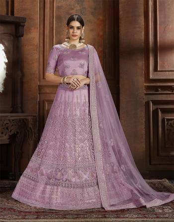 Here Is Very Elegant Looking Heavy Designer Lehenga Choli For The Upcoming Wedding Season In Pretty Lavendor Color. This Lehenga , Choli And Dupatta Are Fabricated On Net Beautified With Heavy Detailed Embroidery. Buy Now.