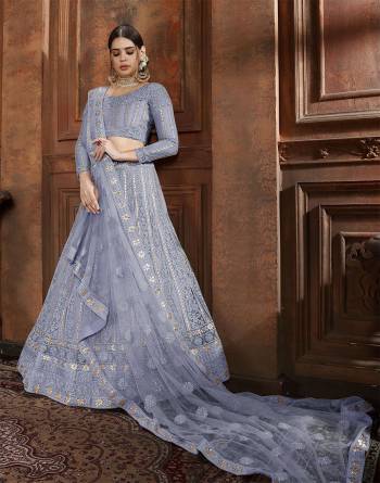 Here Is Very Elegant Looking Heavy Designer Lehenga Choli For The Upcoming Wedding Season In Pretty Powder Blue Color. This Lehenga , Choli And Dupatta Are Fabricated On Net Beautified With Heavy Detailed Embroidery. Buy Now.