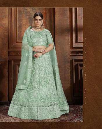 Beautiful And Elegant Looking Shade Is Here To Add Into Your Wardrobe With This Heavy Designer Lehenga Choli In Sea Green Color. This Lehenga Choli And Dupatta Are Fabricated On Net Beautified With Heavy Detailed Embroidery. Buy Now.