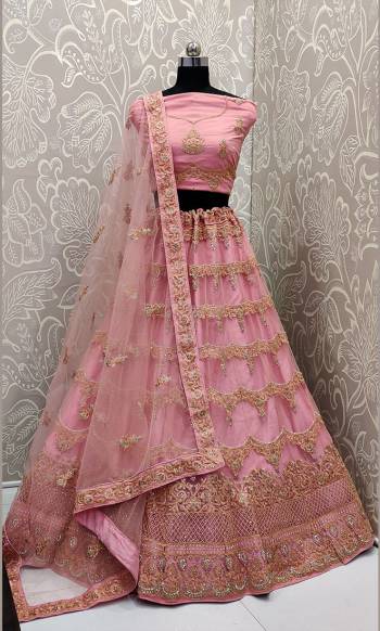 This Wedding Season, Look The Most Graceful Of All Wearing This Heavy Designer Elegant Lehenga Choli In Pink Color. Its Blouse, Lehenga And Dupatta are Fabricated on Net Beautified With Tone To Tone Coding And Resham Embroidery With Stone Work. Buy Now. 