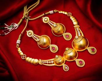 Give An Enhanced Look To Your Personality By Pairing Up This Beautiful Necklace Set With Your Ethnic Attire. This Pretty Set Is In Golden Color Beautified With Stone And Pearl Work. Buy Now.