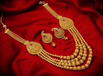 Give An Enhanced Look To Your Personality By Pairing Up This Beautiful Necklace Set With Your Ethnic Attire. This Pretty Set Is In Golden Color Beautified With Stone And Pearl Work. Buy Now.