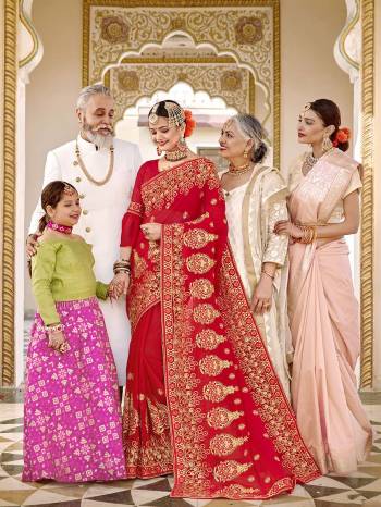 Here Is Beautiful Collection In Bridal Sarees With This Designer?Saree In Red Color Paired With Red Colored Blouse. This Saree And Blouse are Fabricated On Georgette Beautified With Heavy Jari And Resham Embroidery With Stone Work. This Beautiful Heavy Saree Will A Proper Bridal Look And Will Earn You Lots Of Compliments From Onlookers