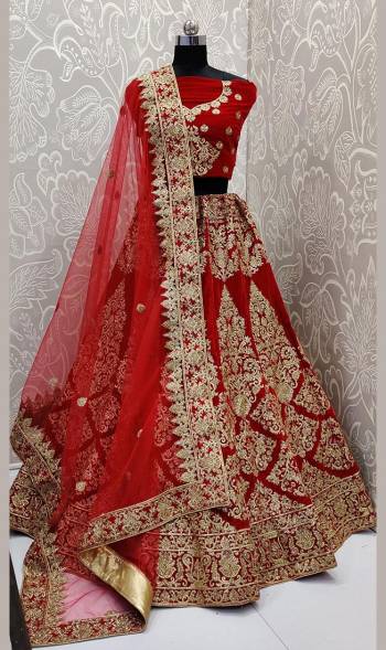 Here Is A Beautiful Designer Bridal Lehenga Choli In Red Color. This Beautiful Heavy Lehenga Choli Is Fabricated On Velvet Paired With Net Fabricated Dupatta. It Is Beautified With Heavy Detailed Embroidery. Get Ready For Your D-Day With This Designer Piece And Look The Most Graceful Of All. 