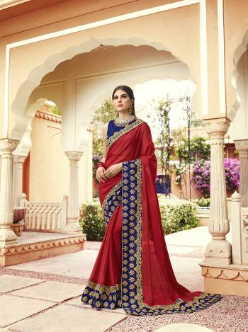 Shine Bright Wearing This Attractive Designer Saree In Red Color Paired With Royal Blue Colored Blouse. This Saree Is Fabricated On Georgette Paired With Art Silk Fabricated Blouse. Its Blouse And Saree Border Are Beautified With Embroidery Giving An Attractive Look. 
