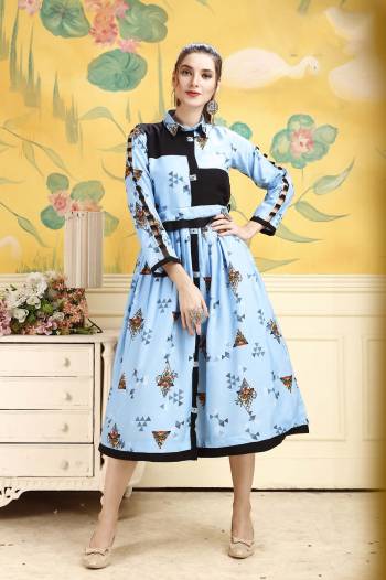 Grab This Pretty Readymade Tunic In Sky Blue Color For Your Semi-Casual Wear. This Pretty Kurti Is Fabricated On Rayon Beautified With Prints All Over. Buy This Pretty Piece Now.