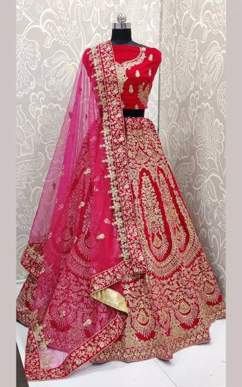 Here Is A Beautiful Designer Bridal Lehenga Choli In Rani Pink Color. This Beautiful Heavy Lehenga Choli Is Fabricated On Velvet Paired With Net Fabricated Dupatta. It Is Beautified With Heavy Detailed Embroidery. Get Ready For Your D-Day With This Designer Piece And Look The Most Graceful Of All