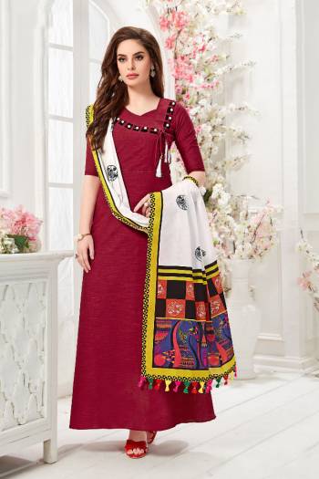 Here Is A Pretty Readymade Gown In Maroon Color Paired With White And Multi Colored Dupatta. This Pretty Gown Is Fabricated On Cotton Slub Paired With Chanderi Cotton Fabricated Dupatta Beautified With Digital Prints. 