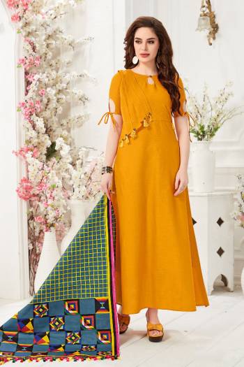 Here Is A Pretty Readymade Gown In Musturd Yellow Color Paired With Blue And Multi Colored Dupatta. This Pretty Gown Is Fabricated On Cotton Slub Paired With Chanderi Cotton Fabricated Dupatta Beautified With Digital Prints. 