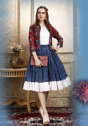 Here Is A Pretty Three Piece Western Set In White Colored Top Paired With Blue Colored Skirt And Maroon Colored Printed Jacket. Its Top Is Fabricated on Cotton Lycra Paired With Rayon Fabricated Skirt and Jacket. 