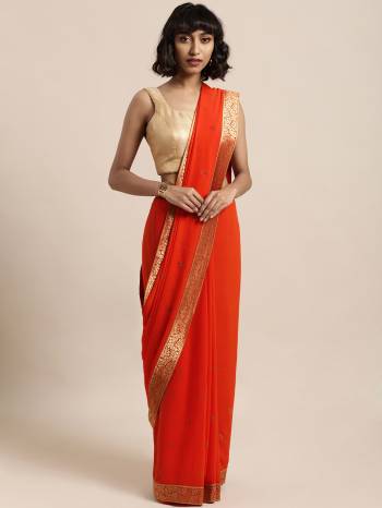 Add This Pretty Elegant Looking Saree To Your Wardrobe In Orange Color Paired With Red Colored Blouse. This Saree Is Fabricated On Georgette Paired With Art Silk Fabricated Blouse. It Is Beautified With Jacquard Lace Border And Stone Work. Buy Now.