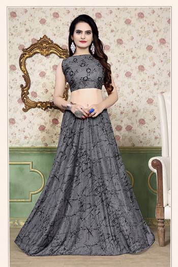 Grab This Beautiful Pair Of Lehenga Choli In Grey Color Fabricated On Lycra. It Has Fully Stitched Lehenga And Unstitched Blouse. Also It Is Beautified With Foil Print Giving It An Attractive Look. Buy Now.