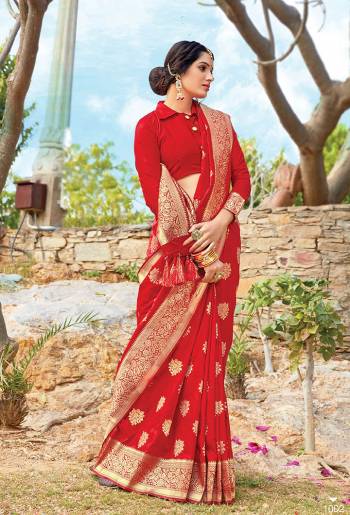 Get Ready For The Upcoming Wedding & Festive Season With This Pretty Saree In Red Color Paired With Red Colored Blouse. This Saree And Blouse Are Fabricated On Art Silk Beautified With Weave All Over. Its Lovely Color and Weave Will Give An Attractive Look To Your Personality. 