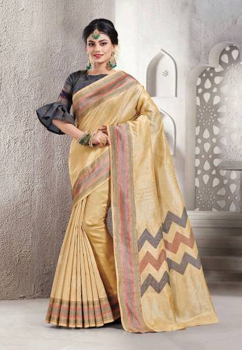 Celebrate This Festive Season With Beauty And Comfort Wearing This Pretty Saree In Cream Color Paired With Dark Grey Colored Blouse. This Saree And Blouse Are Fabricated On Handloom Silk Which Is Light Weight, Durable And Easy To Carry All Day Long. 