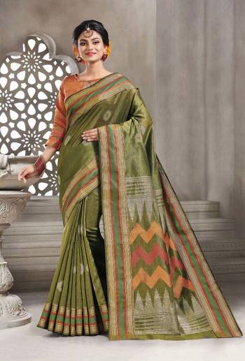 Add This Pretty Rich And Elegant Looking Saree In Olive Green Color Paired With Contrasting Rust Orange Colored Blouse. This Saree And Blouse are Handloom Silk Based Beautified With Weave. Buy This Saree Now.