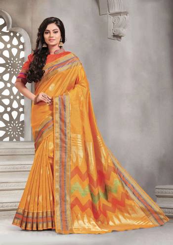 Add This Pretty Rich And Elegant Looking Saree In Musturd Yellow Color Paired With Contrasting Orange Colored Blouse. This Saree And Blouse are Handloom Silk Based Beautified With Weave. Buy This Saree Now.