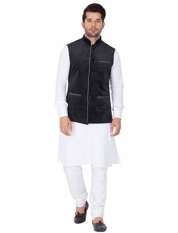 Here Is A Rich And Decent Looking Readymade Pair Of Men's Kurta Pyjama In White Color Paired With Black Colored Jacket. This Kurta And Pyjama Are Fabricated On Cotton Paired With Velvet Fabricated Jacket. Buy This Pair For The Upcoming Wedding And Festive Season. 