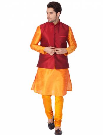 Here Is A Rich And Decent Looking Readymade Pair Of Men's Kurta Pyjama In Orange Color Paired With Red Colored Jacket. This Kurta And Pyjama Are Fabricated On Cotton Silk Paired With Art Silk Fabricated Jacket. Buy This Pair For The Upcoming Wedding And Festive Season. 