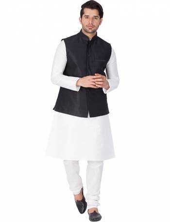 Here Is A Rich And Decent Looking Readymade Pair Of Men's Kurta Pyjama In White Color Paired With Black Colored Jacket. This Kurta And Pyjama Are Fabricated On Cotton Silk Paired With Art Silk Fabricated Jacket. Buy This Pair For The Upcoming Wedding And Festive Season. 