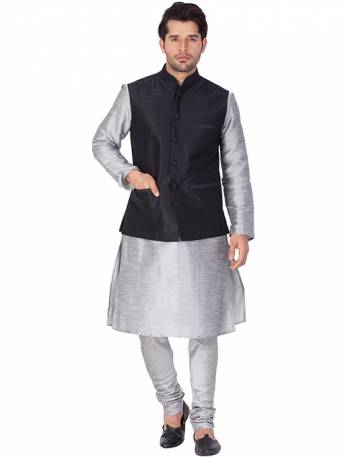 Here Is A Rich And Decent Looking Readymade Pair Of Men's Kurta Pyjama In Grey Color Paired With Black Colored Jacket. This Kurta And Pyjama Are Fabricated On Cotton Silk Paired With Art Silk Fabricated Jacket. Buy This Pair For The Upcoming Wedding And Festive Season. 