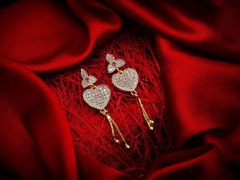 Here Is A Very Pretty Pair Of Simple And Elegant Looking Earring Set In Golden Color. It Has Pretty Unique pattern With Attractive Diamond Work. You can Pair This Even With Simple Attire As Well As A Heavy One. This Pretty Evergreen Design Compliments Any Kind Of Attire You Wear.