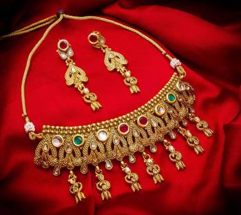 Give An Enhanced Look To Your Personality By Pairing Up This Beautiful Necklace Set With Your Ethnic Attire. This Pretty Set Is In Golden Color Beautified With Stone And Pearl Work. Buy Now