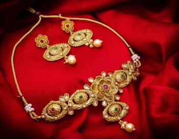 Give An Enhanced Look To Your Personality By Pairing Up This Beautiful Necklace Set With Your Ethnic Attire. This Pretty Set Is In Golden Color Beautified With Stone And Pearl Work. Buy Now