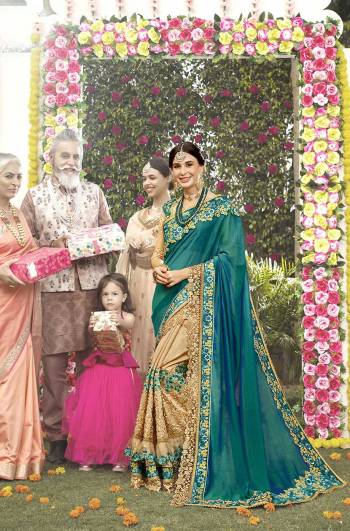 Here Is Heavy Deesigner Saree to Add Into Your Wardrobe For The Upcoming Festive And Wedding Season In Teal Green And Beige Color Paired With Beige Colored Blouse. Its Rich Fabric And Heavy Embroidery Will Earn You Lots Of Compliments From Onlookers.