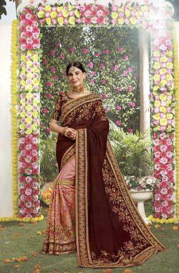 Get Ready For The Upcoming Wedding Season With This Heavy Designer Saree In Brown And Pink Color Paired With Brown Colored Blouse. This Heavy Embroidered Saree And Blouse Are Silk Based With Highlight Pattern Of Embroidered Net Over The Saree Skirt. Buy This Pretty Saree Now.