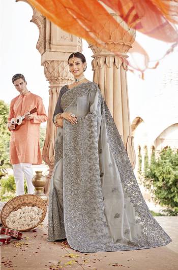 Here Is A Very Pretty Designer Saree to Add Into Your Wardrobe In Lovely Grey Color. This Heavy Embroidered Saree Is Fabricated On Chiffon Paired With Art Silk Fabricated Blouse. Buy Now.