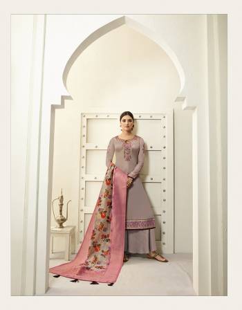 New Shade In Purple Is Here To Add Into Your Wardrobe With This Designer Straight Cut Suit In Mauve Color. Its Embroidered Top Is Fabricated On Satin Georgette Paired With Santoon Bottom And Jacquard Silk Fabricated Weaved And Digital Printed Dupatta. 