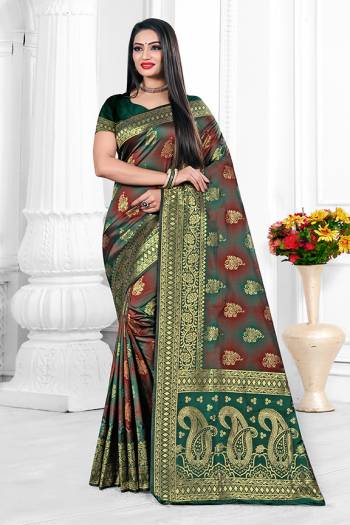 Adorn A Bold And Beautiful Look Wearing This Elegant Patterned Designer Saree In Teal Green And Maroon Color. This Saree Is Fabricated On Cotton Silk Paired With Art Silk Fabricated Blouse. Buy Now.