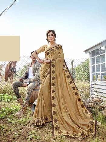Celebrate This Festive Season Wearing This Designer Saree In Beige Color Paired With Beige Colored Blouse. This Saree Is Fabricated On Satin Georgette Paired With Art Silk Fabricated Blouse. 