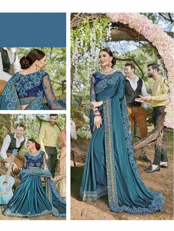 Go With The Lovely Shades Of Blue Wearing This Heavy Designer Saree In Blue Color Paired With Royal Blue Colored Blouse. This Saree Is Satin Georgette Based Paired With Art Silk And Net Fabricated Blouse. 
