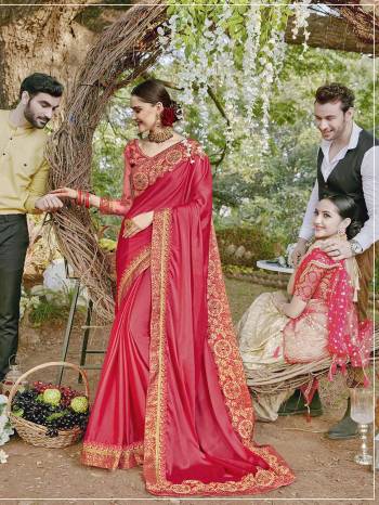 Adorn The Pretty Angelic Look Wearing This Designer Saree In Dark Pink Color Paired With Dark Pink Colored Blouse. This Saree Is Satin Georgette Based Paired With Art Silk And Net Fabricated Blouse. It Is Beautified With Heavy Embroidered Blouse And Saree Lace Border. 