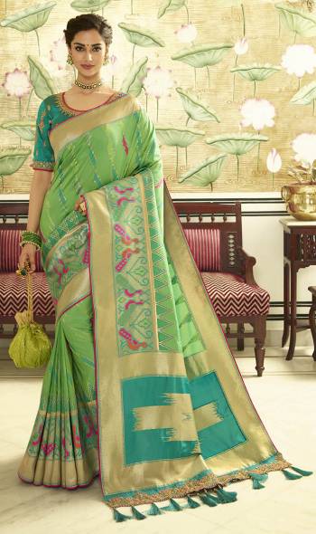 For A Proper Traditional Look, Grab This Designer Saree In Light Green Color Paired With Contrasting Turquoise Blue colored Blouse. This Heavy Weaved Saree Is Banarasi Art Silk Based Paired With Art Silk Fabricated Heavy Embroidered Blouse. Buy This Saree Now.