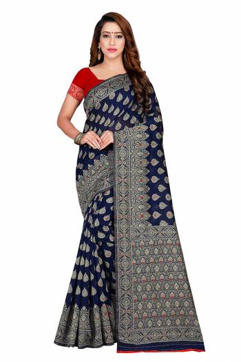 Celebrate This Festive Season With Beauty And Comfort Wearing This Designer Silk Based Saree. This Saree And Blouse Are Fabricated on Banarasi Art Cotton Beautified With Weave. Its Rich Fabric Is Durable , Light Weight And Easy To Carry All Day Long. 