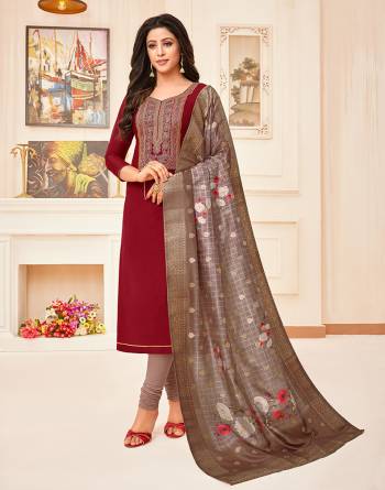 For A Royal Look, Grab This Pretty Dress Material In Maroon Color Paired With Mauve Colored Bottom And Dupatta. Its Top Is Soft Cotton Based Paired With Santoon Bottom And Chanderi Silk Fabricated Rich Dupatta. 