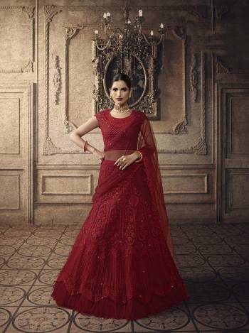 Here Is A Very Beautiful Heavy Designer Lehenga Choli For The Upcoming Wedding Season In All Over Red Color. This Heavy Embroidered Lehenga Choli Is Net Based Beautified With Detailed Tone To Tone Embroidery. Buy This Rich And Elegant Looking Piece Now.