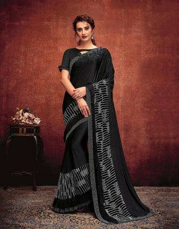 It's time to ace the minimal yet outstanding saree look in this gorgeous black saree with fancy fabric details . Drape it in half-falling style for an elegant look. 