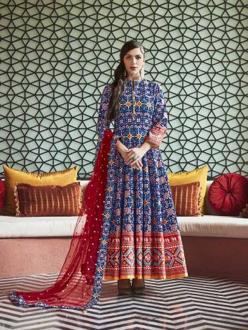 Here Is A Readymade Designer Floor Length Suit In Blue Color Paired With Contrasting Red Colored Dupatta. Its Attractive Printed Top Is Fabricated On Soft Silk Paired With Cotton Crepe Fabricated Bottom And Sequence Worked Net Fabricated Dupatta. This Readymade suit Is Available In All Regular Sizes. Buy Now.