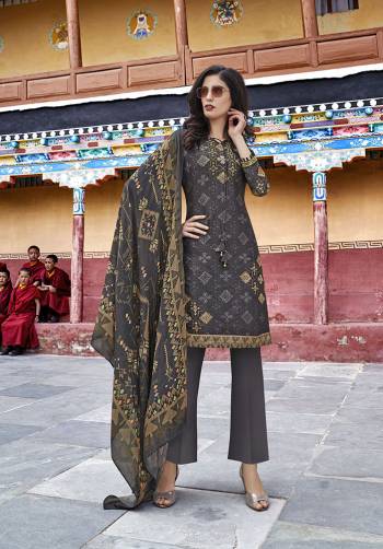 Grab This Designer Suit In Dark Grey Color Paired With Dark Grey Colored Bottom And Dupatta. Its Top Is Fabricated On Soft Silk Paired With Cotton Satin Bottom And Chiffon Fabricated Dupatta. All Its Fabrics Are Light Weight And Ensures Superb Comfort All Day Long. 