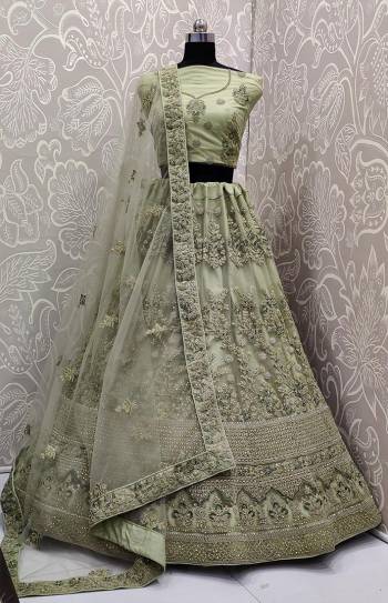 Look The Most Elegant Of All This Wedding Season Wearing This Heavy Designer Lehenga Choli In Mint Green Color. This Beautiful Heavy Tone To Tone Embroidered Lehenga Choli Is Fabricated On Net. Its Rich Color and Detailed Embroidery Will earn You Lots Of Compliments From Onlookers. 