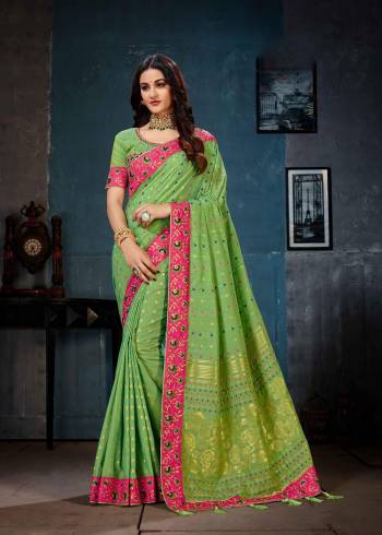 Celebrate This Festive Season Wearing This Heavy Designer Saree In Green Color. This Lovely Saree And Blouse Are Fabricated On Linen Cotton Silk Beautified With Weave And Embroidery. Buy This Saree Now.