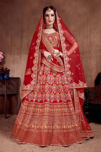 Here Is The Seasons Trending Designer Lehenga Choli In Two Dupatta Concept. This Pretty Lehenga Choli Is In Red With Another Red Colored Dupatta. Its Blouse And Lehenga Are Fabricated On Tafeta Art Silk Paired With Both Net Dupattas. It Has Very Beautiful And Attractive Embroidery. Buy Now.