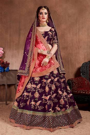 Here Is The Seasons Trending Designer Lehenga Choli In Two Dupatta Concept. This Pretty Lehenga Choli Is In Purple With Another Crimson Red Colored Dupatta. Its Blouse And Lehenga Are Fabricated On Tafeta Art Silk Paired With Both Net Dupattas. It Has Very Beautiful And Attractive Embroidery. Buy Now.