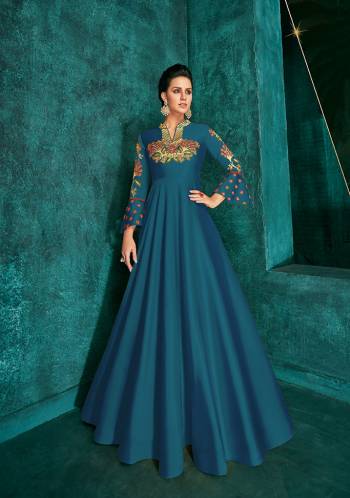 Celebrate This Festive Season Wearing This Designer Readymade Gown In Blue Color Fabricated On Soft Art Silk Beautified With Embroidery. Its Rich Fabric And Color Will Definitely Earn You Lots Of Compliments From Onlookers.