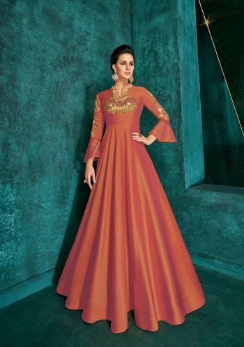 Celebrate This Festive Season Wearing This Designer Readymade Gown In Rust Orange Color Fabricated On Soft Art Silk Beautified With Embroidery. Its Rich Fabric And Color Will Definitely Earn You Lots Of Compliments From Onlookers.