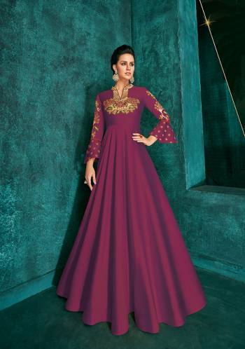 Celebrate This Festive Season Wearing This Designer Readymade Gown In Magenta Pink Color Fabricated On Soft Art Silk Beautified With Embroidery. Its Rich Fabric And Color Will Definitely Earn You Lots Of Compliments From Onlookers.