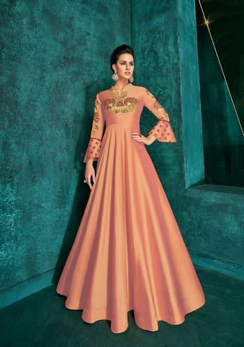 Celebrate This Festive Season Wearing This Designer Readymade Gown In Peach Color Fabricated On Soft Art Silk Beautified With Embroidery. Its Rich Fabric And Color Will Definitely Earn You Lots Of Compliments From Onlookers.